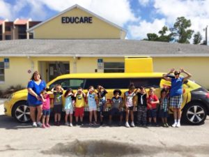 children stand along side the Truly Nolan stretched car