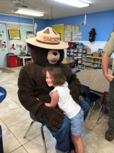 Smokey the Bear teaches forest fire prevention at EduCare Academy