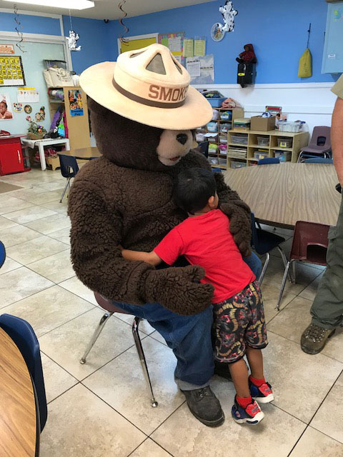 Smokey the Bear teaches forest fire prevention at EduCare Academy