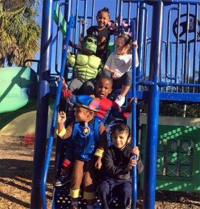 Children dressed up in costumes on October 31, to celebrate Super Hero day.