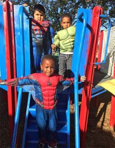 Children dressed up in costumes on October 31, to celebrate Super Hero day.