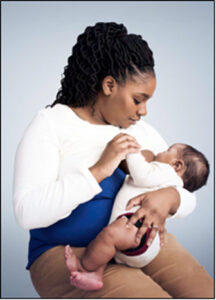 Woman of color breastfeeding her baby
